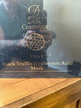 This is a D24K Cosmetics 12 in 1 Black Truffle Hyaluronic Acid Mask box.